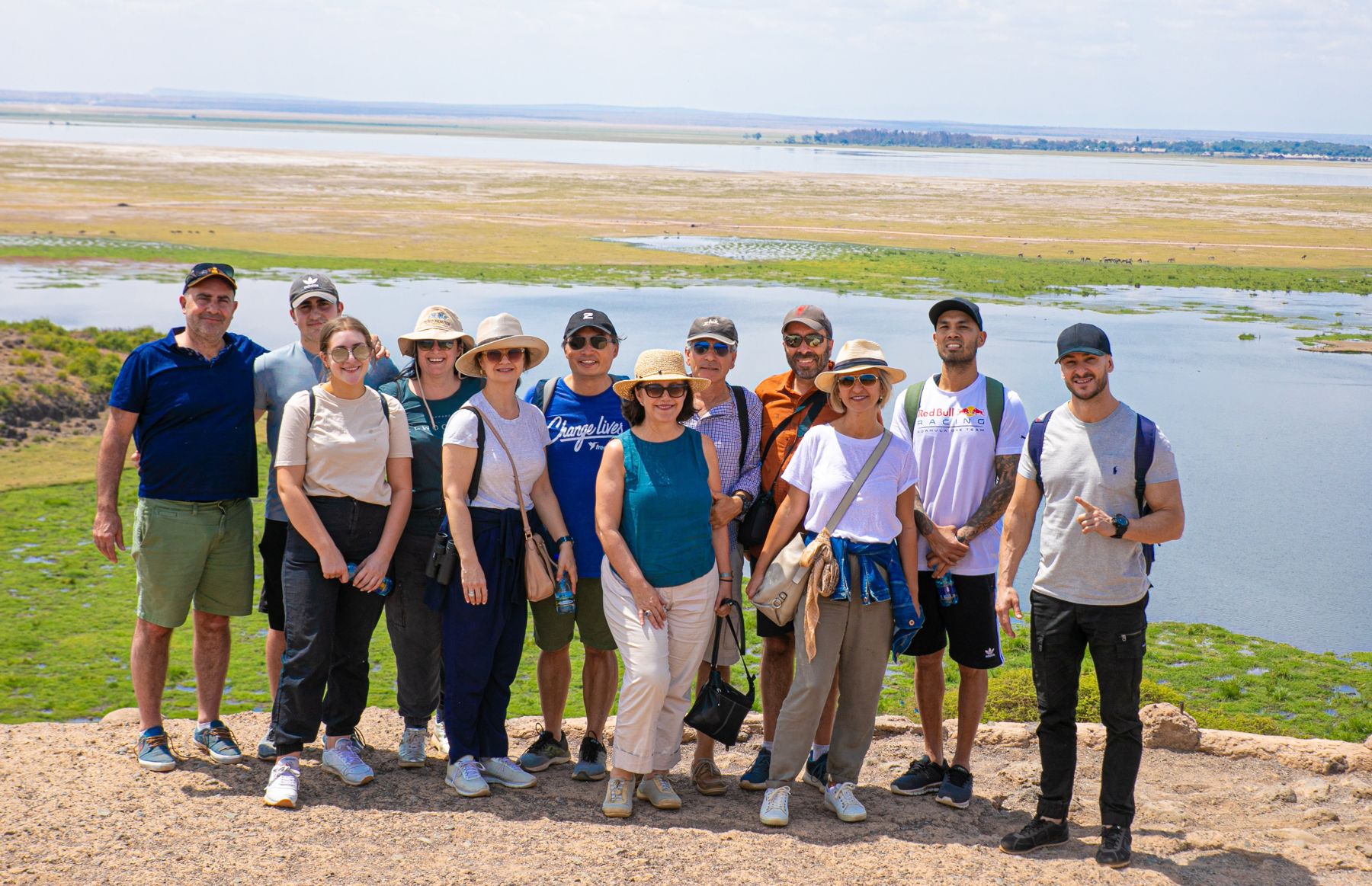 A group of Real Masai Safari guests on a lookout above the Amboseli wetlands